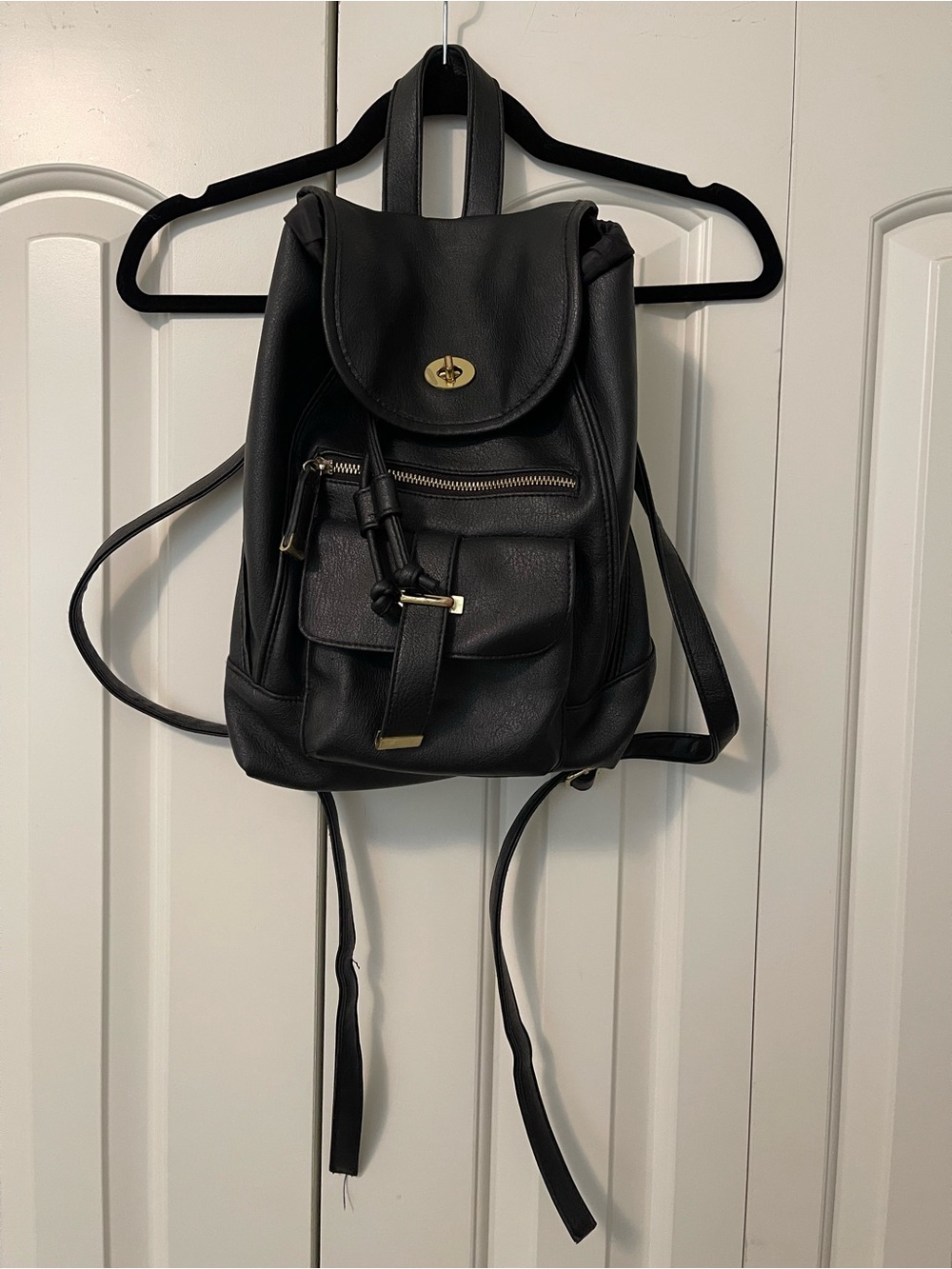 Sleek Black Faux Leather Mini Backpack with Gold Accents
